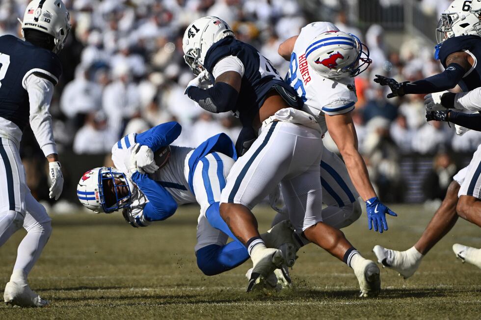 Penn State linebacker Kobe King tackles SMU running back Brashard Smith (1) during the first...