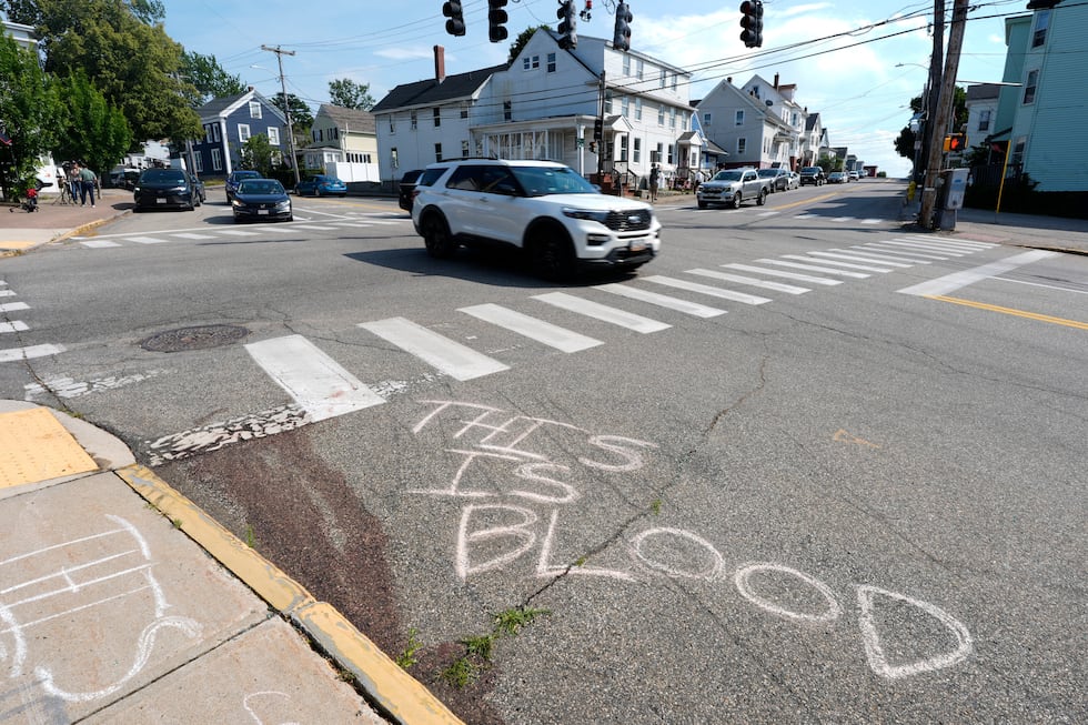 Blood is seen on the pavement near the scene of a shooting involving U.S. Immigration and...