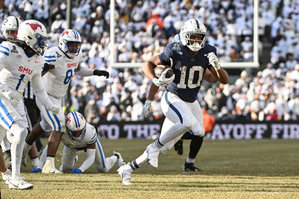 Penn State running back Nicholas Singleton (10) runs past SMU safety Brandon Crossley during...